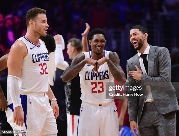 Austin Rivers, Lou Williams and Blake Griffin of the LA Clippers laugh during a stop in play in a 113-102 Clipper win over the Houston Rockets at...