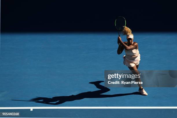 Destanee Aiava of Australia plays a backhand in her first round match against Simona Halep of Romania on day two of the 2018 Australian Open at...
