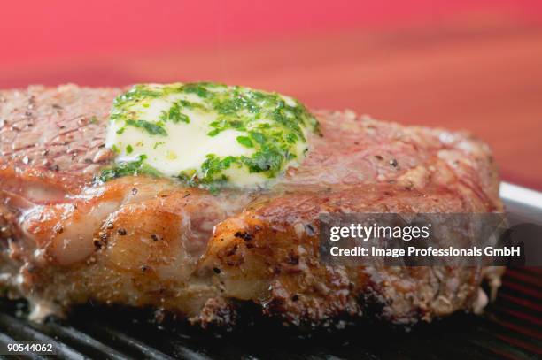 beef steak with herb butter on barbecue, close up - herb butter stock pictures, royalty-free photos & images