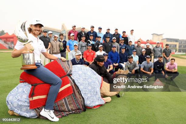 Tommy Fleetwood of England and other members of the European tour pose during a photocall for the Abu Dhabi HSBC Golf Championship at Abu Dhabi Golf...