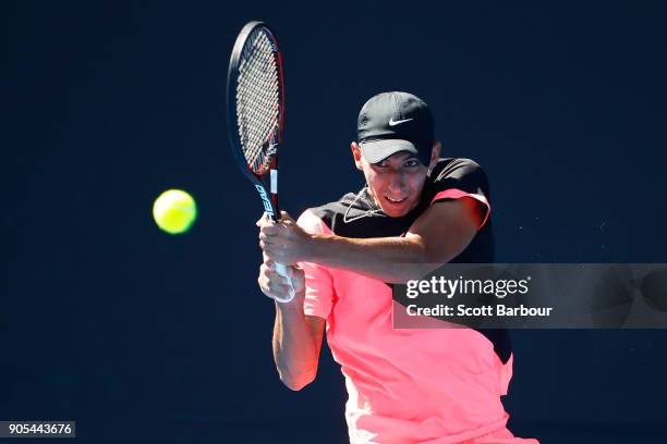 Alexei Popyrin of Australia plays a backhand in his first round match against Tim Smyczek of the United States on day two of the 2018 Australian Open...