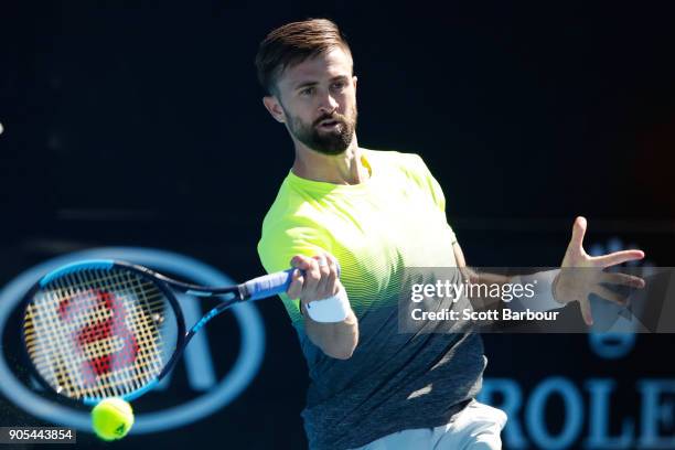 Tim Smyczek of the United States plays a forehand in his first round match against Alexei Popyrin of Australia on day two of the 2018 Australian Open...