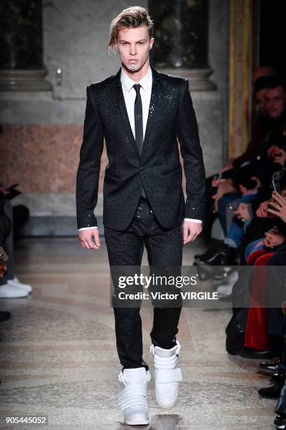 Model walks the runway at the Les Hommes show during Milan Men's Fashion Week Fall/Winter 2018/19 on January 13, 2018 in Milan, Italy.