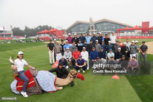 Tommy Fleetwood of England and other members of the European Tour pose during a photocall for the Abu Dhabi HSBC Golf Championship at Abu Dhabi Golf...