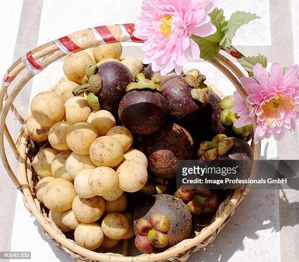 basket of longans and mangosteens, close up - longan stock pictures, royalty-free photos & images