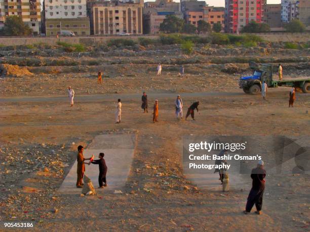 streets of karachi - cricket player silhouette stock pictures, royalty-free photos & images