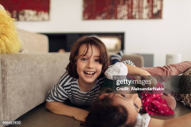 love between brother and sister - tickling stock pictures, royalty-free photos & images