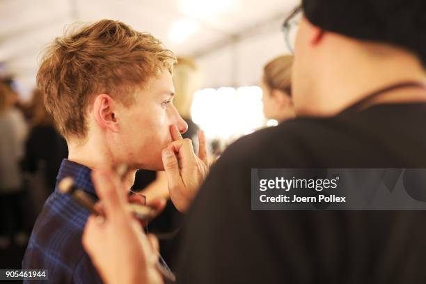 Model gets prepared ahead of the Ivanman show during the MBFW January 2018 at ewerk on January 16, 2018 in Berlin, Germany.