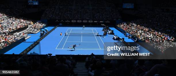 Spectators watch the men's singles first round match between Switzerland's Stanislas Wawrinka and Lithuania's Ricardas Berankis on day two of the...