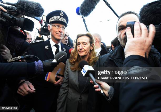 French Justice Minister Nicole Belloubet speaks to journalists as she arrives to visit Vendin-le-Vieil prison on January 16 as French prison guards...