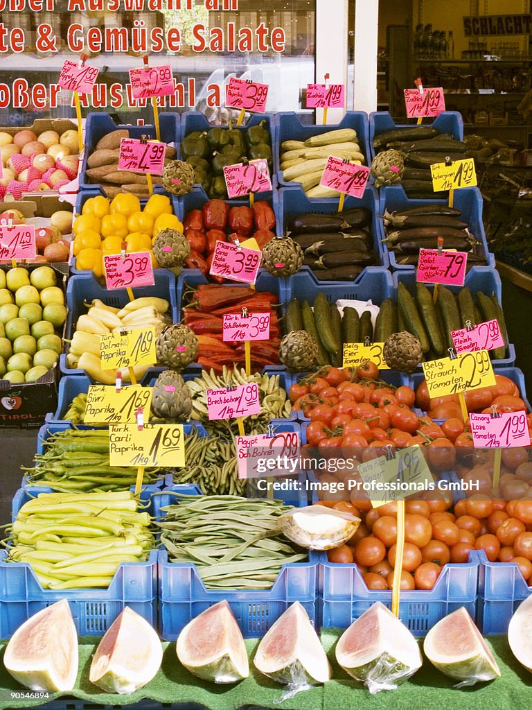 Fruit and vegetables with price tags in crates