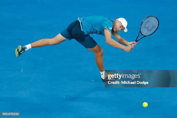 Alex Di Minaur of Australia plays a backhand in his first round match against Tomas Berdych of the Czech Republic on day two of the 2018 Australian...