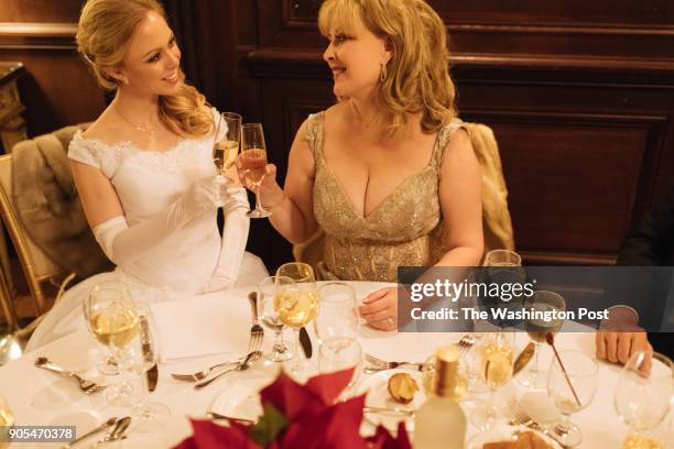 Debutante Alexandra Fuiks shares a champagne cheers with her mother Dr. Elena Holak after her dubut at the Russian Ball in Washington, DC on January...