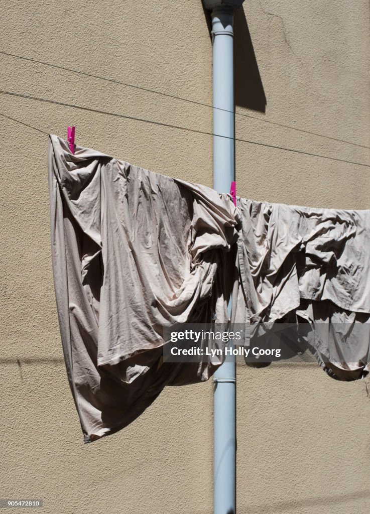 Sheet drying in the sun in inner-city Lisbon