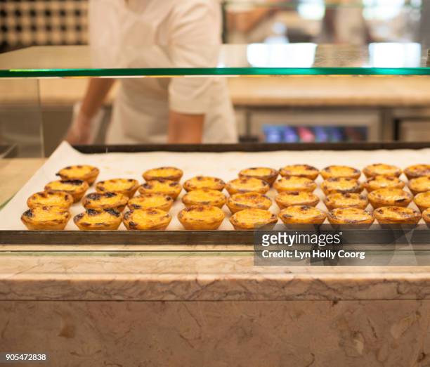 portuguese custard tarts ( pastel de nata) for sale in portuguese market - lyn holly coorg stock pictures, royalty-free photos & images