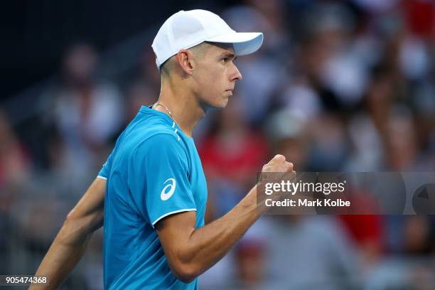 Alex Di Minaur of Australia celebrates winning a point in his first round match against Tomas Berdych of the Czech Republic on day two of the 2018...