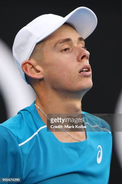 Alex Di Minaur of Australia looks on in his first round match against Tomas Berdych of the Czech Republic on day two of the 2018 Australian Open at...
