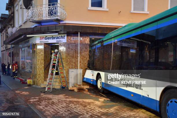 View of a schoolbus that crashed into a shop on early January 16, 2018 in the southern German town of Eberbach, near Heideleberg. - At least 47...