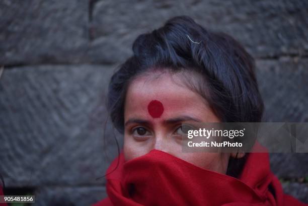 Portrait of Nepalese Hindu woman during at Pashupathnath Temple, Kathmandu during Madhav Narayan Festival or Swasthani Brata Katha on Tuesday,...