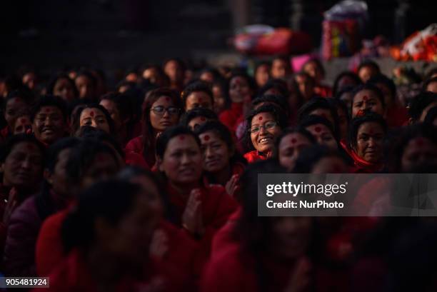 Nepalese Hindu woman offering ritual prayer at Pashupathnath Temple, Kathmandu during Madhav Narayan Festival or Swasthani Brata Katha on Tuesday,...