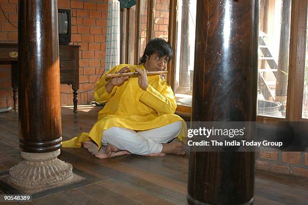 Shashank, youngest Bamboo flutist at his residence in Chennai, Tamil Nadu, India