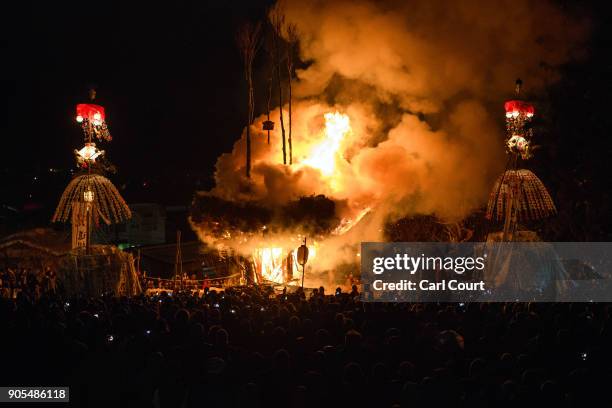 The shrine burns during the Nozawaonsen Dosojin Fire Festival on January 15, 2018 in Nozawaonsen, Japan. The festival is staged by village men of...