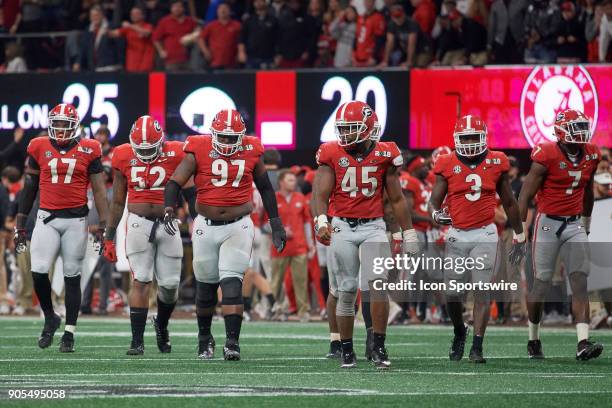 Georgia Bulldogs linebacker Davin Bellamy , Georgia Bulldogs defensive lineman Tyler Clark , Georgia Bulldogs nose tackle John Atkins , Georgia...