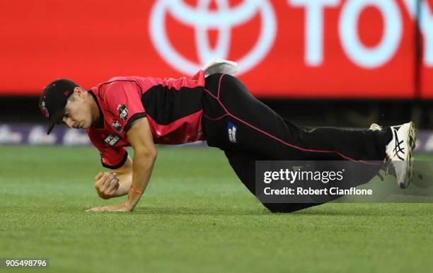 Sean Abbott of the Sydney Sixers takes a catch to dismiss James Faulkner of the Stars during the Big Bash League match between the Melbourne Stars...