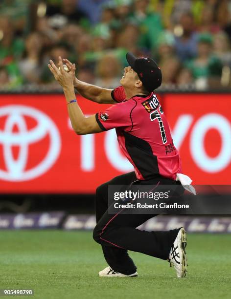 Sean Abbott of the Sydney Sixers takes a catch to dismiss James Faulkner of the Stars during the Big Bash League match between the Melbourne Stars...
