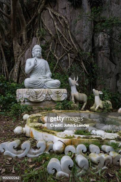 Buddha under the Bodhi Tree with Deer and Dharma Wheel - The Marble Mountains are made up of five hills made of marble and limestone near Danang...