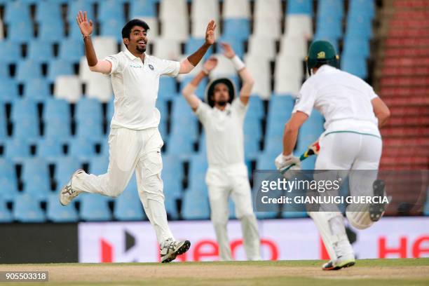 Indian bowler Jasprit Bumrah reacts after bowling on South African bowler AB de Villiers during the third day of the second Test cricket match...