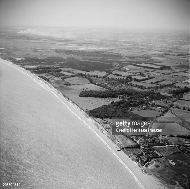 The village and the Common, Dunwich, Suffolk, from the north-east, 1949. This view includes numerous wartime anti-invasion defences. Artist Aerofilms.