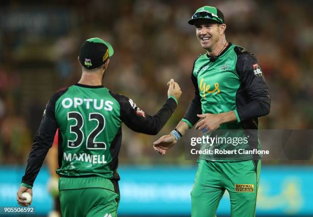 Glenn Maxwell of the Stars celebrates with Kevin Pietersen after he took a catch to dismiss Joe Denly of the Sydney Sixers during the Big Bash League...