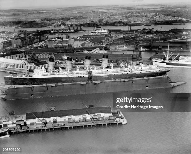 The original RMS 'Mauretania' in the floating dry dock, Southampton, Hampshire, 1933. Designed by Leonard Peskett and built by Swan, Hunter & Wigham...