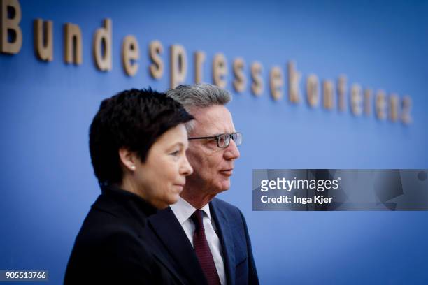 German Interior Minister Thomas de Maiziere and Jutta Cordt, head of Federal Agency of Migration and Refugees, join the federal press conference, on...