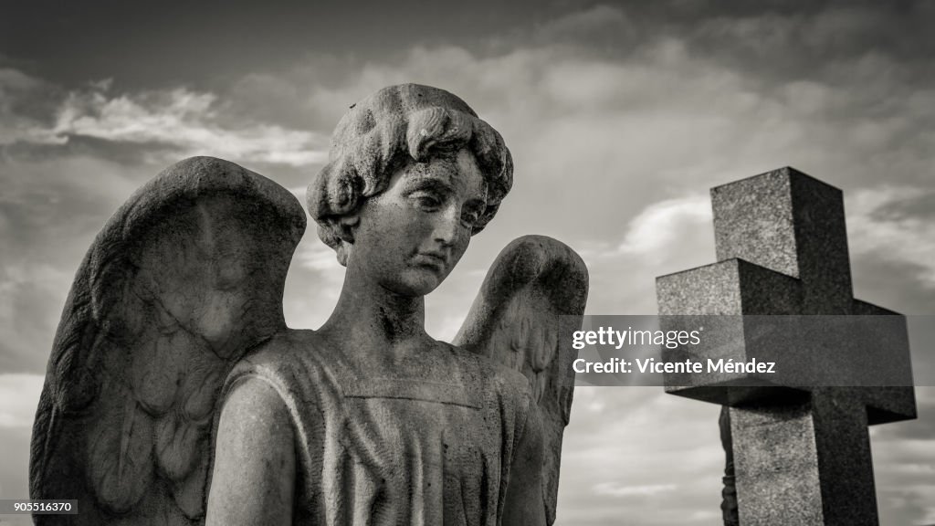 Angel and cross in the cemetery