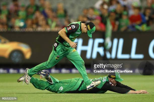 Ben Dunk and Evan Gulbis of the Stars both attempt to make a catch during the Big Bash League match between the Melbourne Stars and the Sydney Sixers...