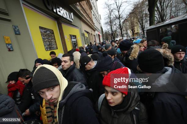 Sneaker enthusiasts wait in line to purchase the very limited edition adidas EQT Support 93/Berlin shoe outside the Overkill sneaker store on January...