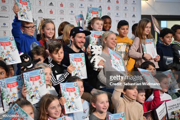 Felix Neureuther and his wife Miriam Neureuther pose with children during the 2018 PyeongChang Olympic Games German Team kit handover at Postpalast...
