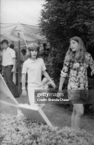 Young John F. Kennedy Jr. Walks with his sister Caroline in this undated file photo. July 16, 2000 marks the one-year anniversary of the plane crash...