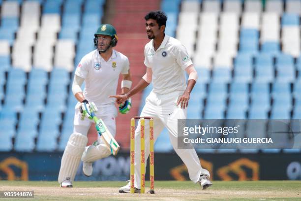 South African batsman and Captain Faf du Plessis takes a run as Indian bowler Jasprit Bumrah looks on during the fourth day of the second Test...