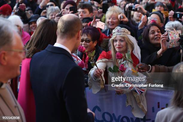 Prince William, Duke of Cambridge and Catherine, Duchess of Cambridge speak to a woman in the crowd dressed as Lady Godiva as they arrive for their...