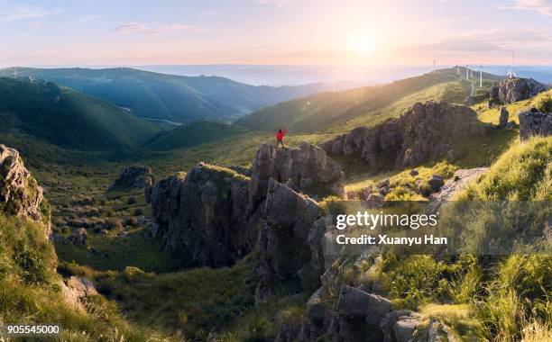 hiker on mountains enjoy sunrise - success in a majestic sunrise stock pictures, royalty-free photos & images