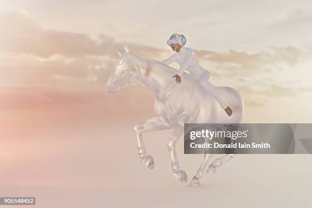 woman wearing virtual reality goggles riding horse in sky - augmented reality animal stock-fotos und bilder