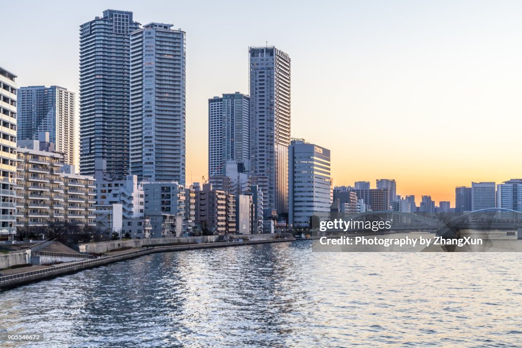 Tokyo waterfront cityscape at sunset, chuo ward, Tokyo, Japan.