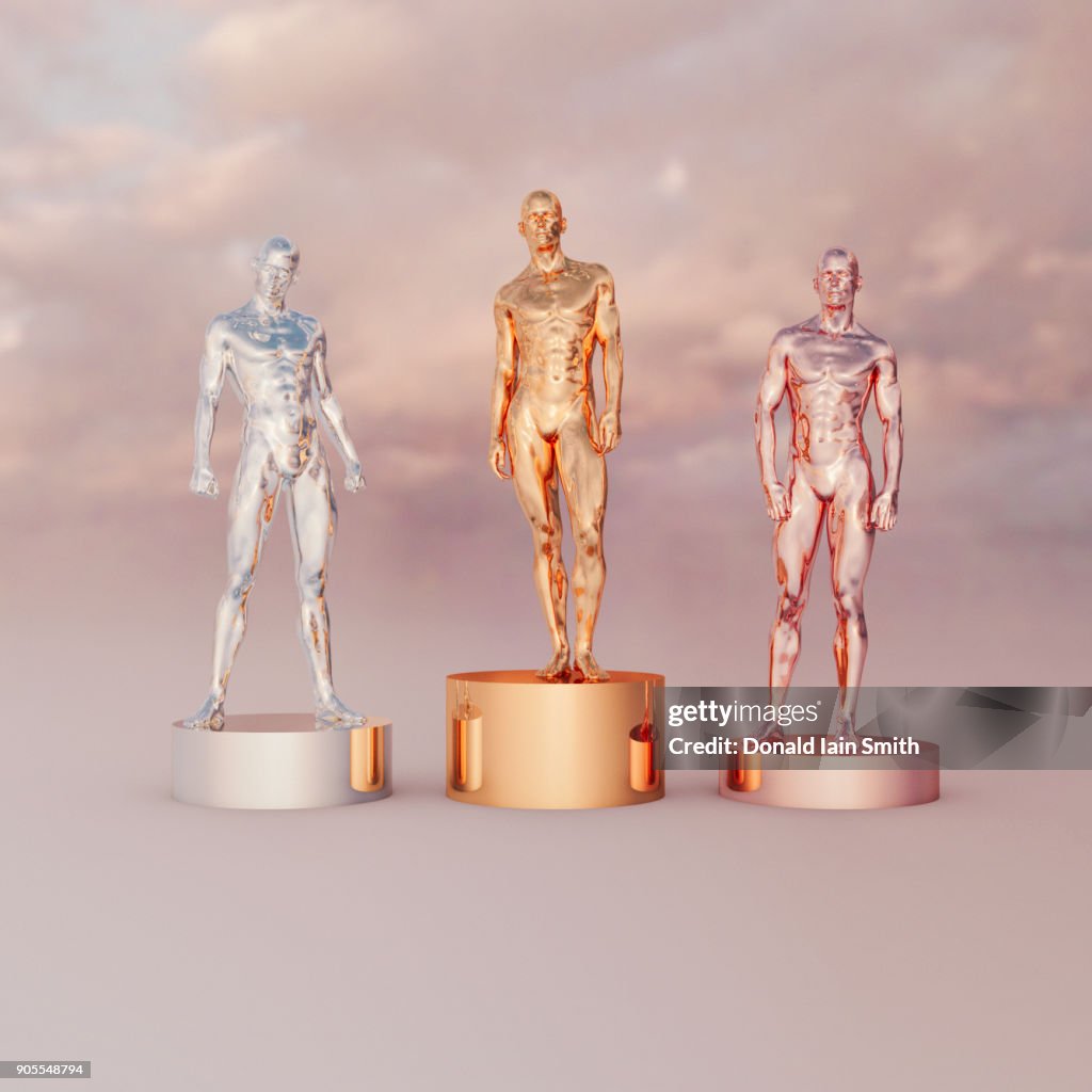 Gold, silver and bronze men on pedestals