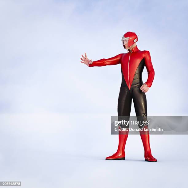 man wearing superhero costumes gesturing stop - man in costume stock pictures, royalty-free photos & images