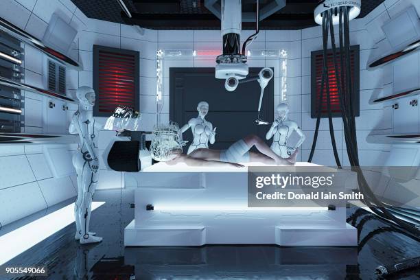 robot women performing medical examination of man - robot surgery stock pictures, royalty-free photos & images