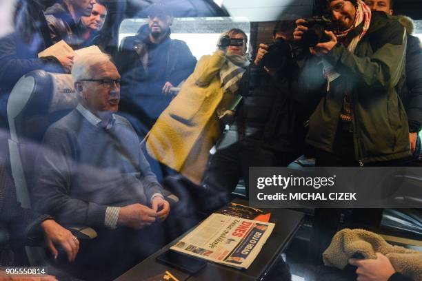 Candidate for the presidential election Jiri Drahos and his wife Eva pose for media in a train at the Prague main train station for the start of the...