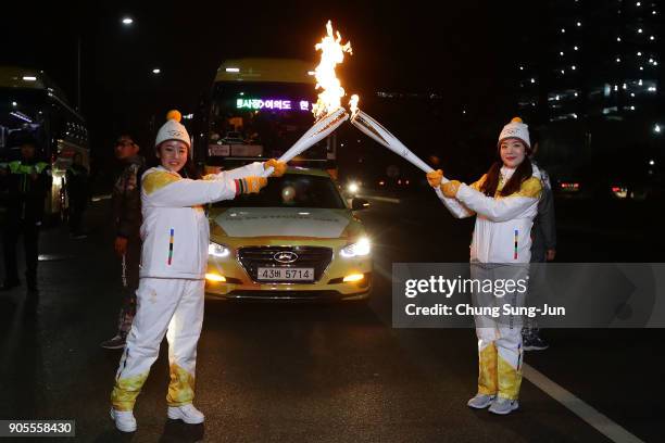 Torch bearers pose with the PyeongChang 2018 Winter Olympics torch during the PyeongChang 2018 Winter Olympic Games torch relay on January 16, 2018...